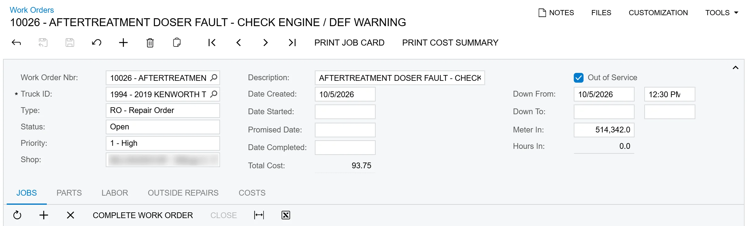 Work order in Acumatica for an aftertreatment fault, marked Out of Service, with the complaint on the job line